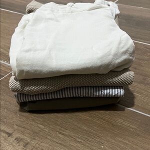 Stack of Neutral Colored Clothing